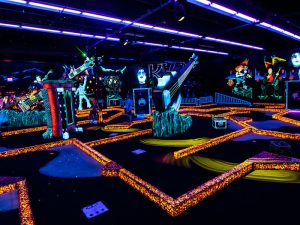 Things to do with your friends - play indoor miniature golf.